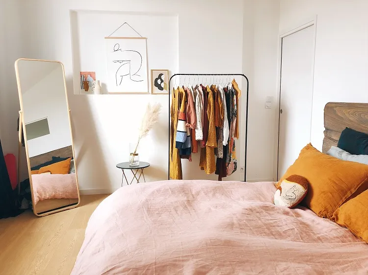 arrange small bedroom layout storage ideas utilizing space floor standing mirror clothing rack