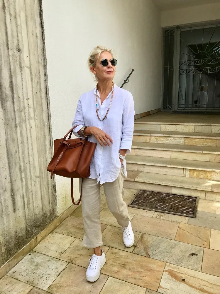 baggy linen shirt beige pants white sneakers big leather handbag casual outfit ideas women over 70