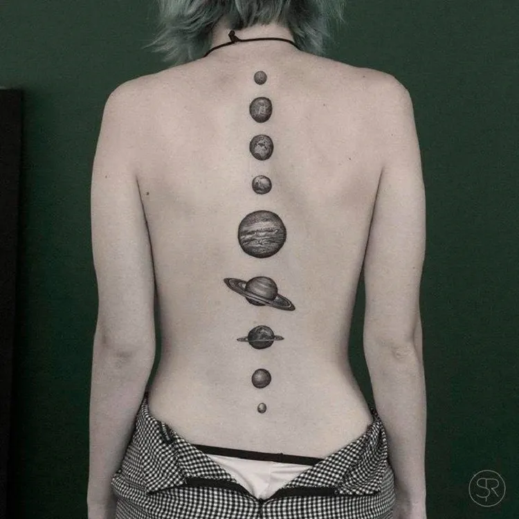 black and white solar system planets spine tattoo idea