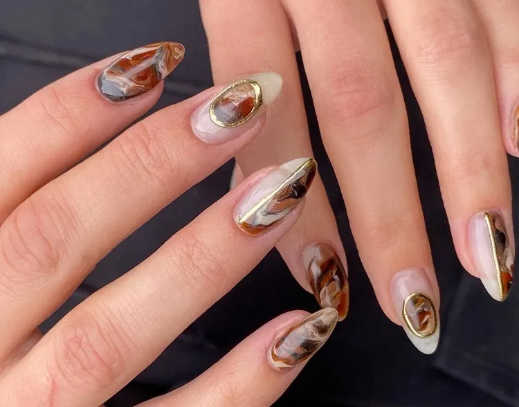 caramel latte nails with gold almond shape 2023