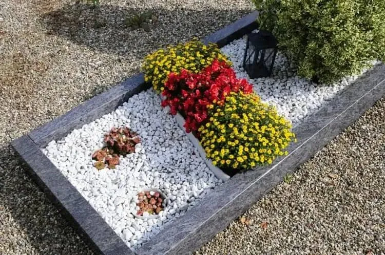 decorate grave with stone gravel border and flowers design