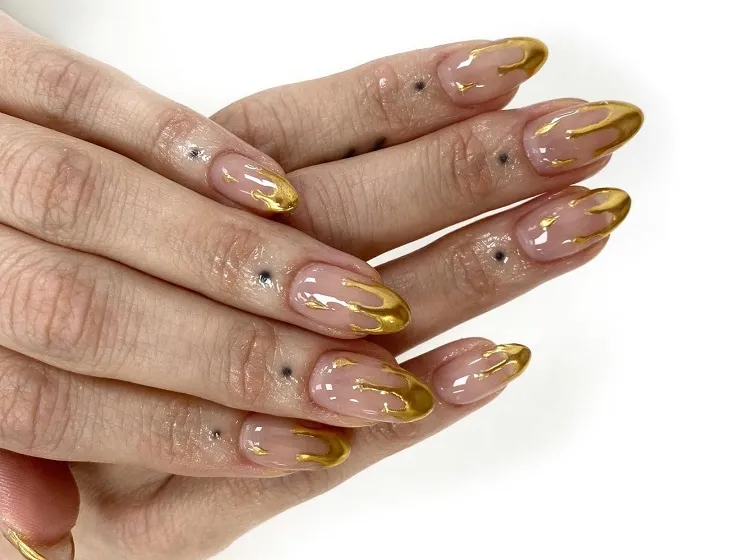 dripping gold french tip nails almond shaped 2023