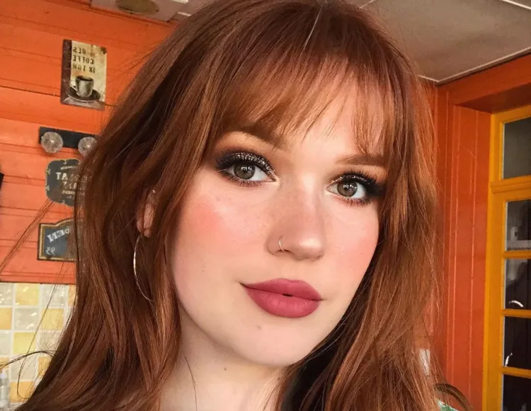 edgy red hair with chic bangs
