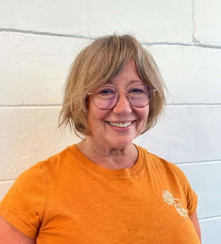 french bob with curtain bangs for women over 60 with glasses short haircuts