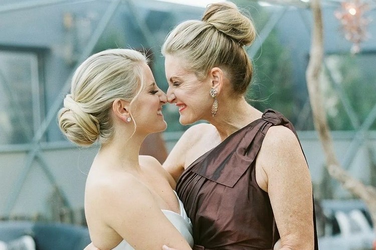 high bun mother of the bride chic hairstyles for women over 60