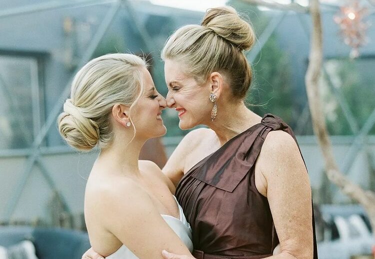 high bun mother of the bride chic hairstyles for women over 60