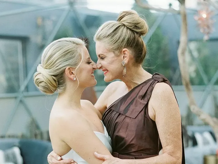 high bun mother of the bride chic hairstyles for women over 60