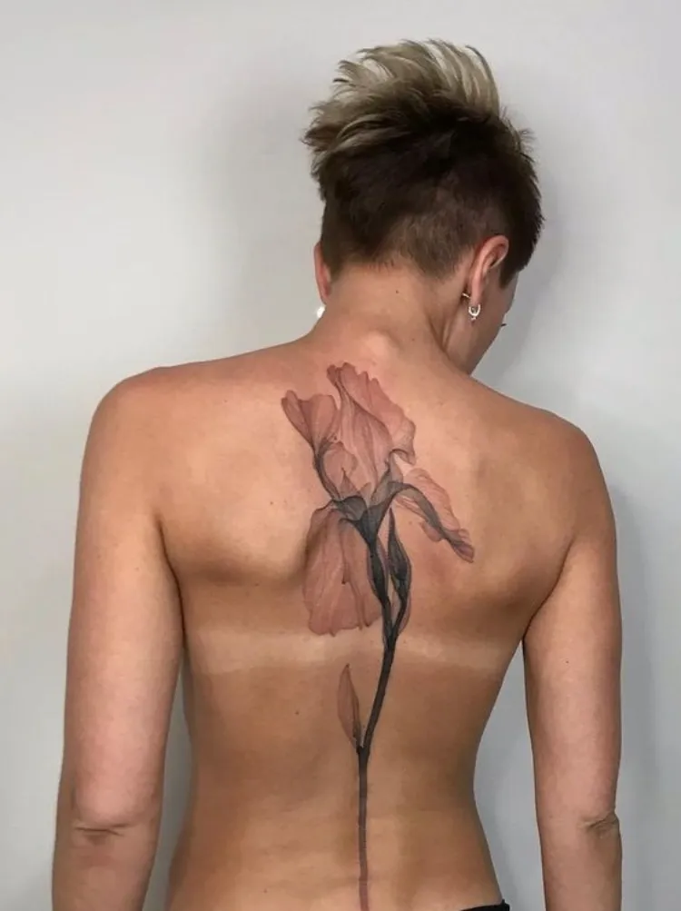 iris spine tattoo design single needle minimalist back piece women