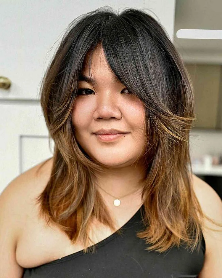 layered hairstyle with curtain bangs hides double chin