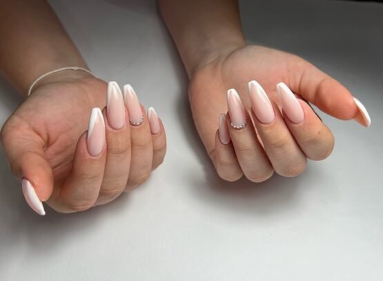 long coffin french tip nails with rhinestones