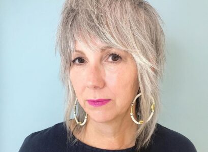 long shaggy bob for women over 50 with bangs 2023