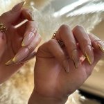 long stiletto gold french tip nails 2023