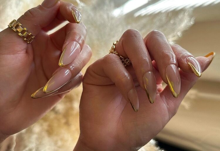 long stiletto gold french tip nails 2023