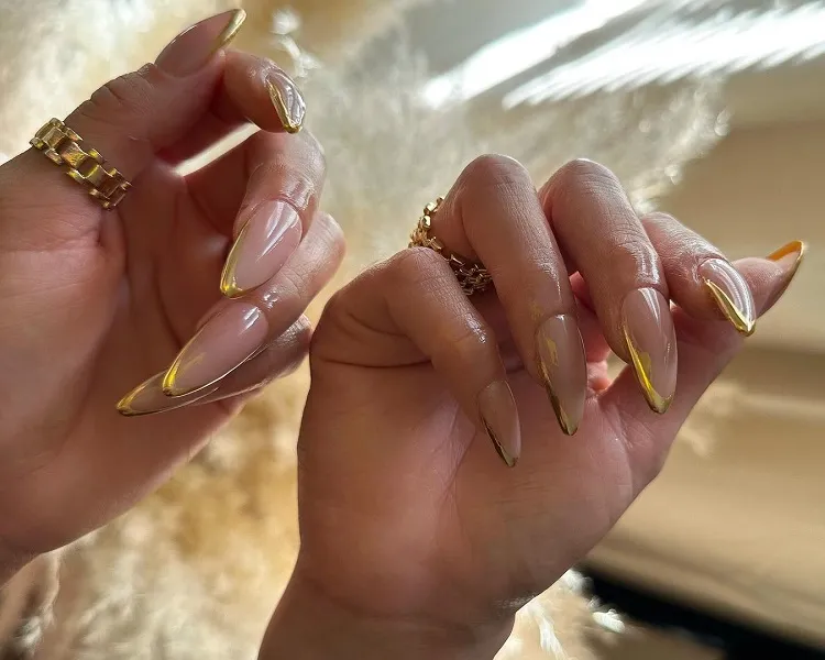 long stiletto gold french tip nails 2023