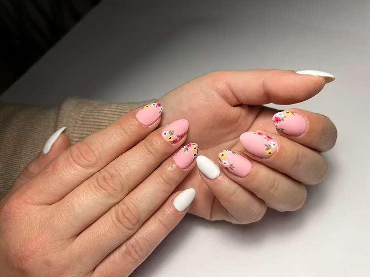 matte pink pastel nails with flower decoration