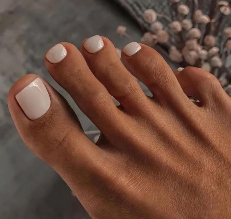 milky white toe nail design simple minimalistic pedicure fall trends 2023