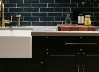 modern black kitchen cabinets long t bar brass hardware subway tile backsplash