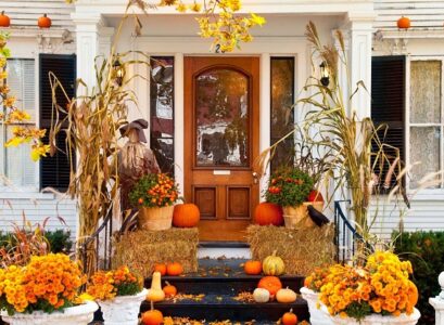 modern fall porch decor include pumpkins colored in golden
