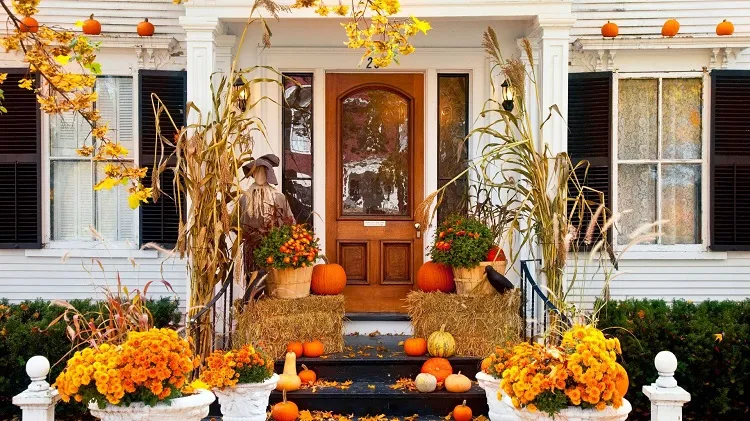 modern fall porch decor include pumpkins colored in golden
