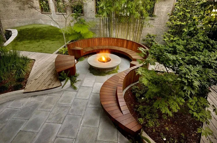 modern landscape design ideas concrete fire pit curved wooden bench