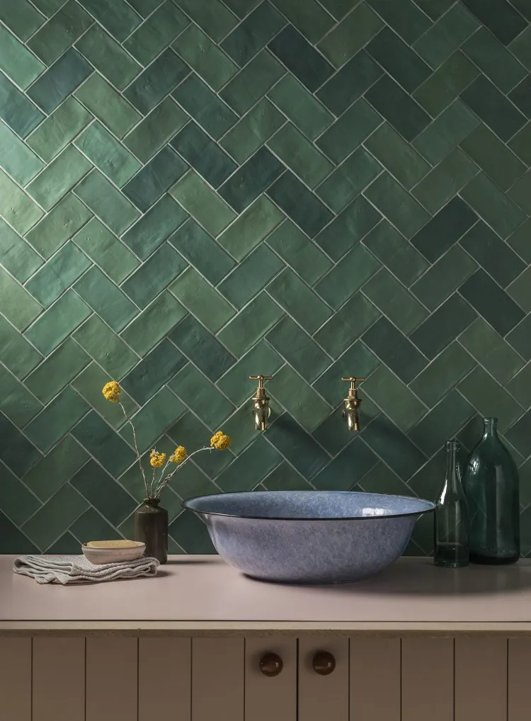 multiple shades green herringbone subway tiles pattern modern bathroom design 2023