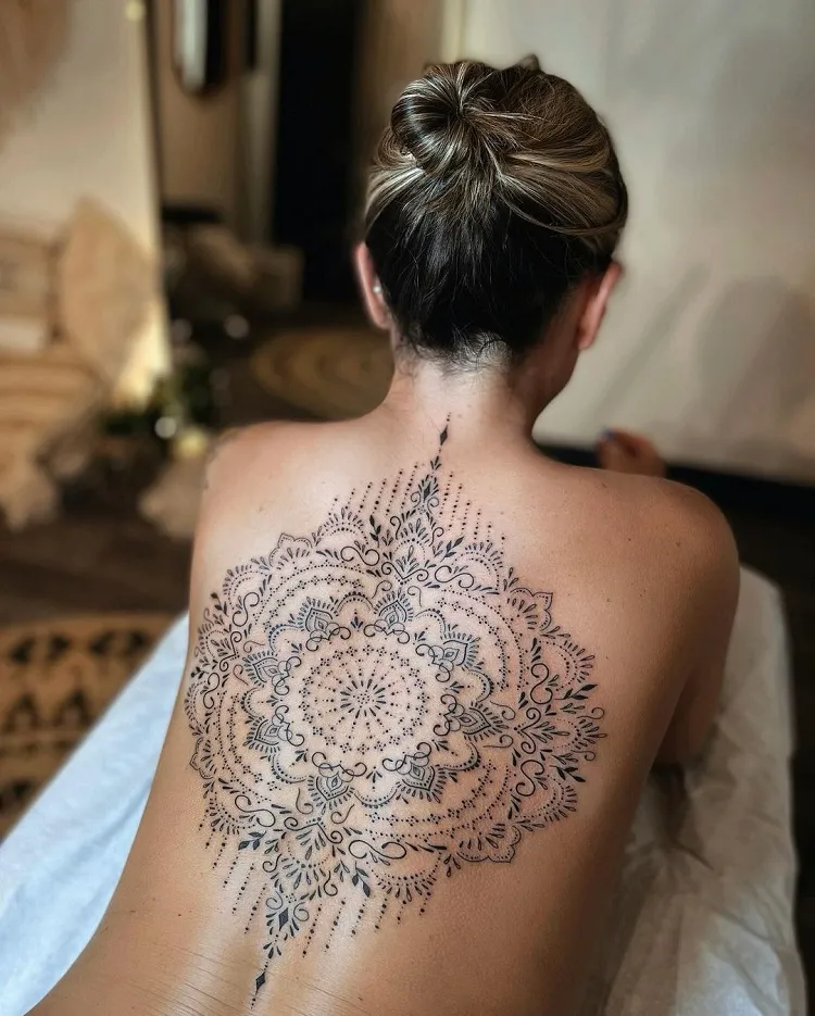 ornamental mandala spine tattoo female design idea