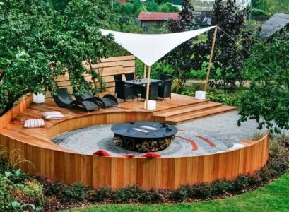 semi circle patio design circular fire pit wooden deck seating shade sail
