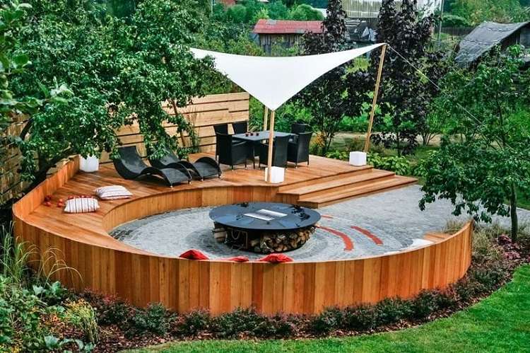 semi circle patio design circular fire pit wooden deck seating shade sail