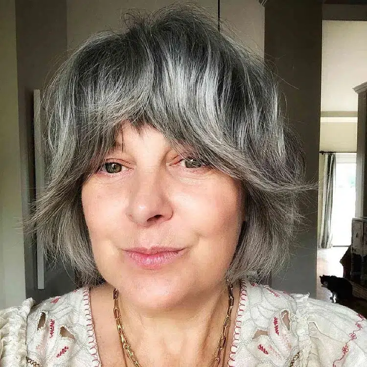 shaggy bob haircut with curtain bangs for women over 50 with square face