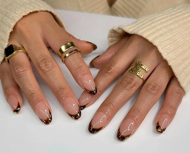 short almond french tip nails with gold and black autumn 2023