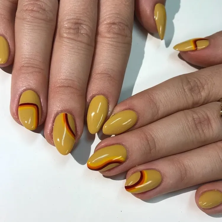 short almond september nails mustard nail polish brown swirls 70s manicure design 2023