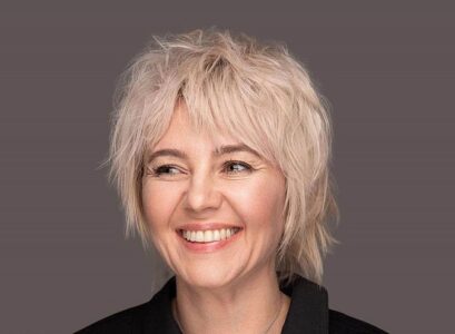 short shaggy bob with face framing bangs for women over 50