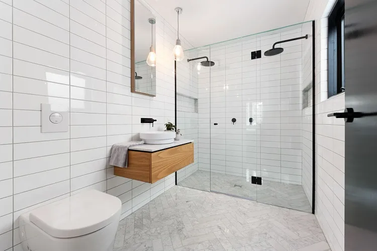 simple minimalist all white bathroom design modern symmetrical horizontal subway tile pattern