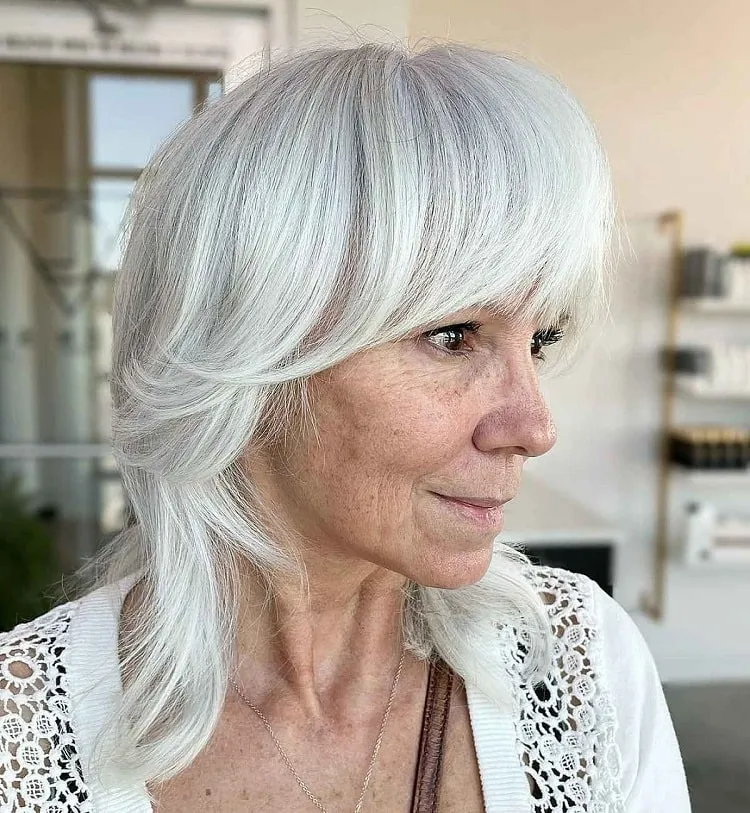 soft wolf cut over 60 with bangs white hairstyles for older women