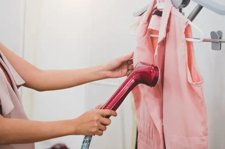 steam your clothes to remove the smell of sweat