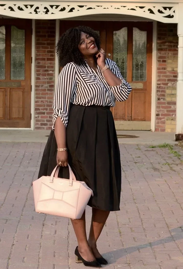 stylish black skirt and striped shirt