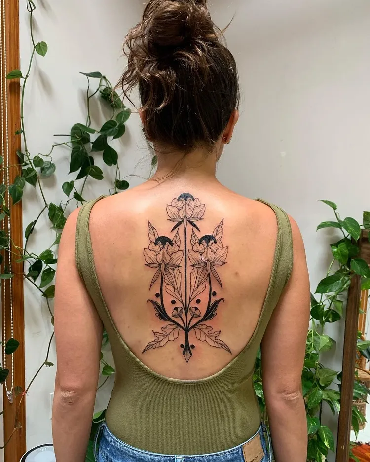 symmetrical ornamental botanical spine tattoo design