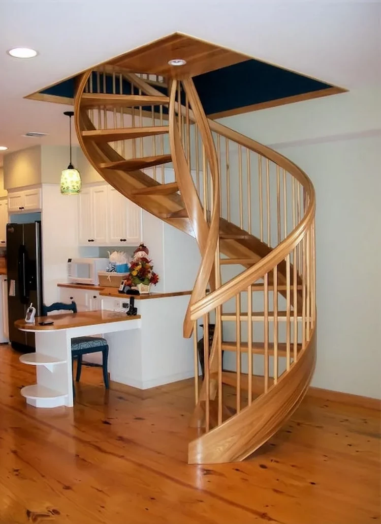 unique spiral staircase with wooden railing