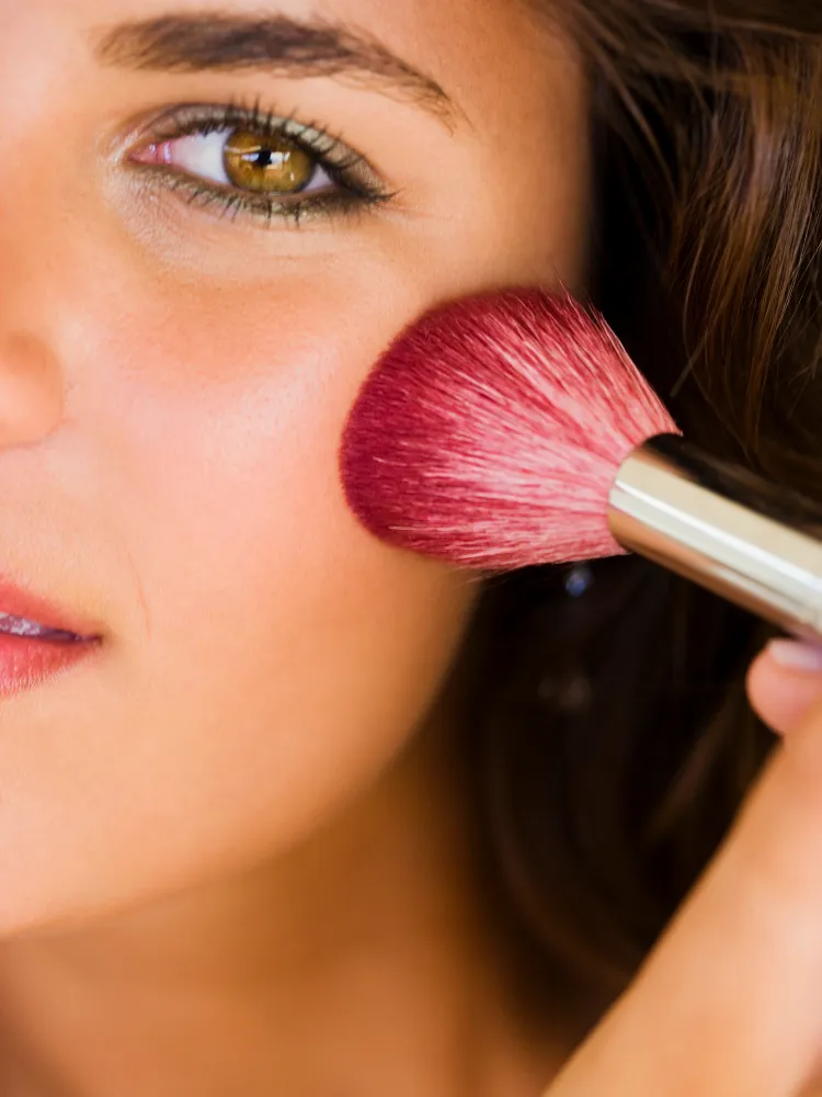 woman round face applying blush simple technique