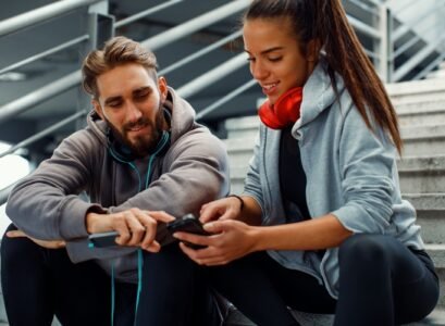 young couple choosing music before running