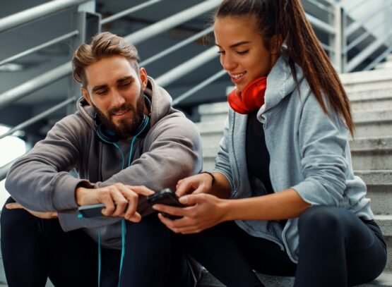 young couple choosing music before running