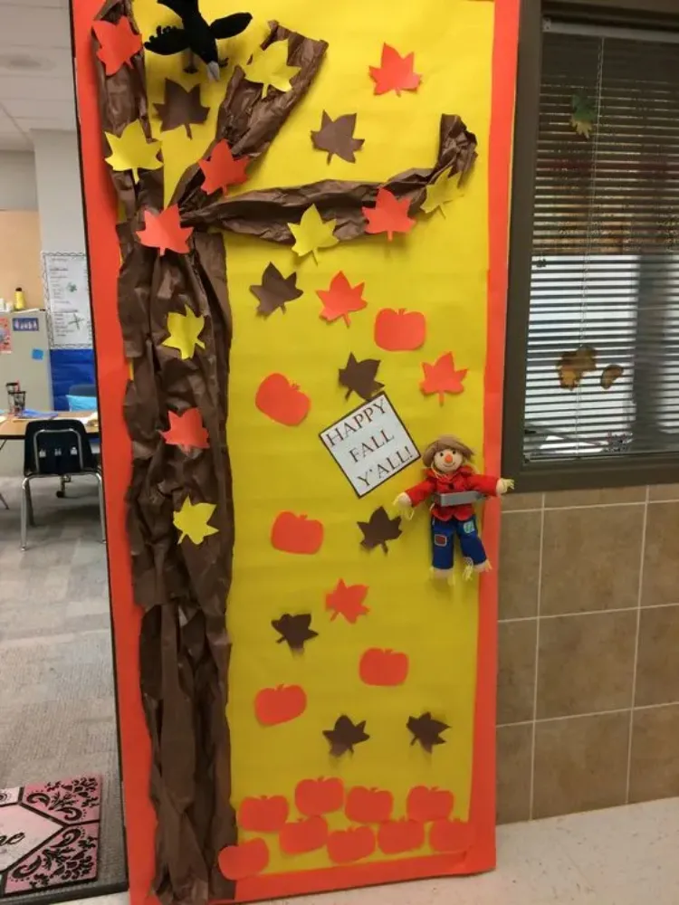 autumn classroom door decoration idea falling leaves small pumpkins