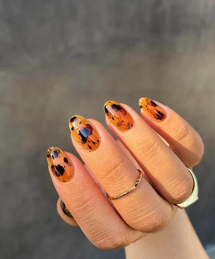 burnt orange fall nails black ink splatter abstract design