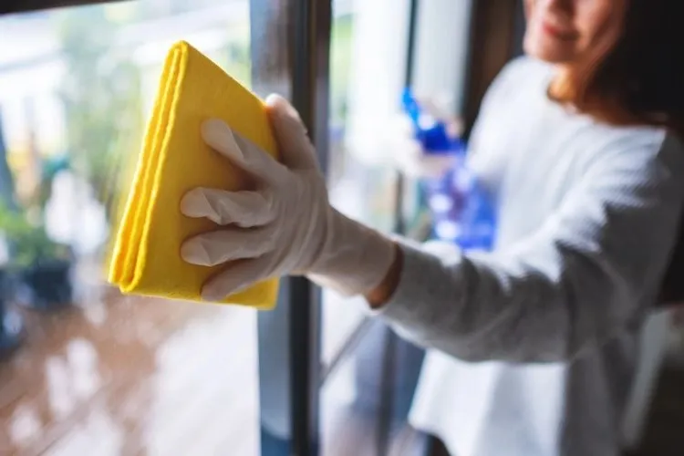 carefully without using aggressive window cleaners clean between glass panes and window frames