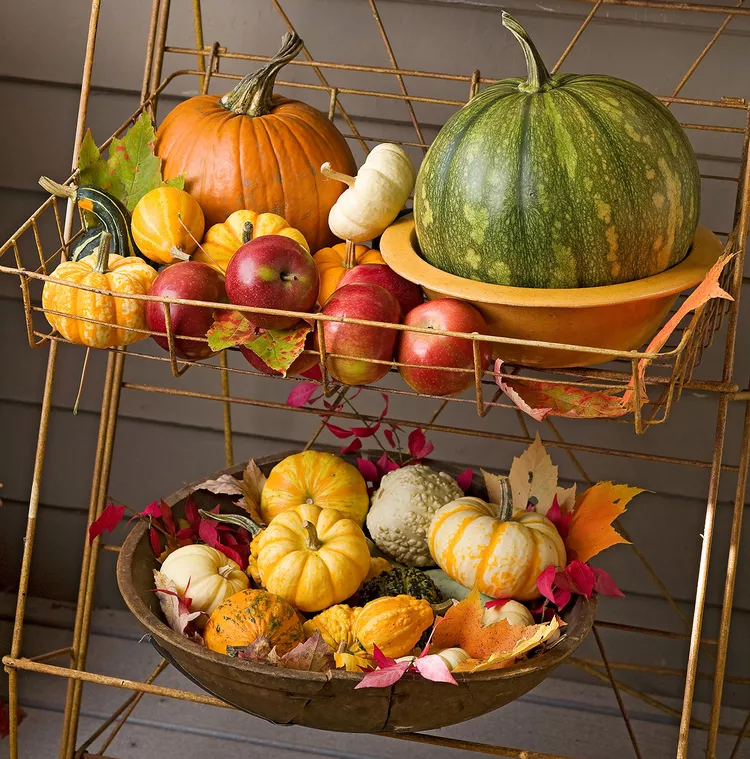 fall decorations for house entrance with pumpkins and fall leaves