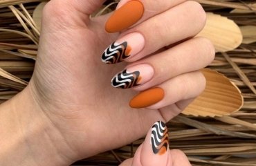 matte burnt orange fall nails abstract wavy french tips design 2023
