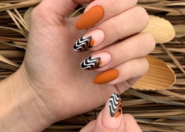 matte burnt orange fall nails abstract wavy french tips design 2023