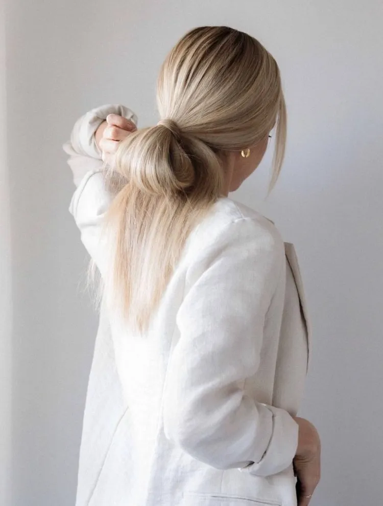 messy low bun simple hairstyles for work 2023 women hair trends