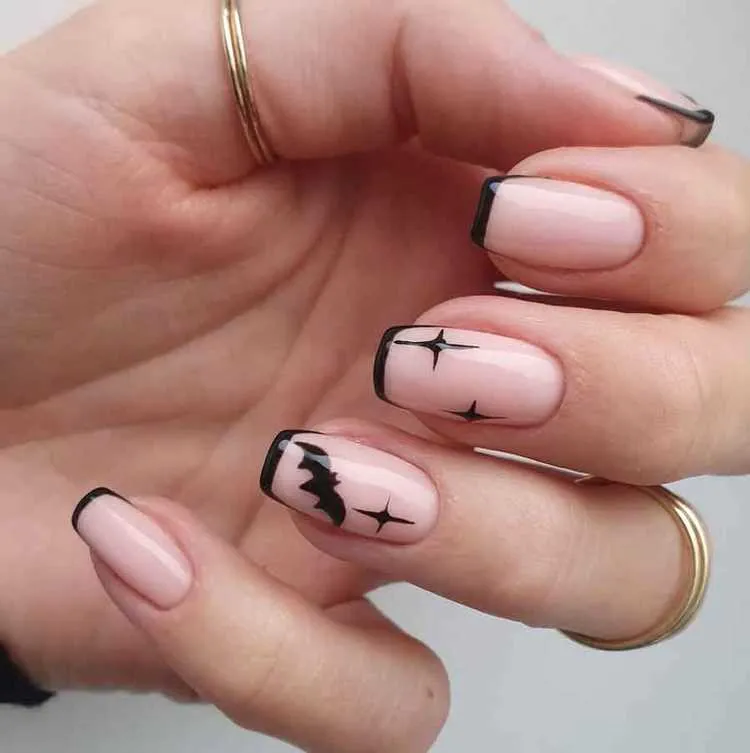 minimalist black bat halloween french tip nails
