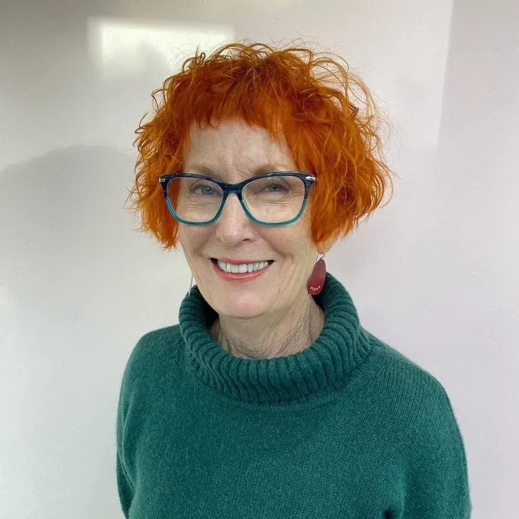 modern red french bob with micro bangs for women over 60
